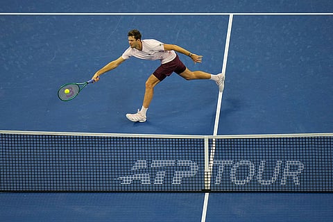 Hubert Hurkacz of Poland, returns a ball to Alex De Minaur, of Australia, during the men's single semi-final match at the China Open tennis tournament in Beijing, Monday, Oct. 5, 2026.