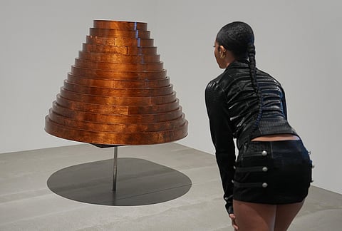 An artwork "Table Skirt from Afterwords collection, autumn/winter 2000," by Hussein Chalayan is displayed during a media preview of "The 90s: Art and Fashion exhibition" at Tate Britain in London, Tuesday, Oct. 6, 2026. 
