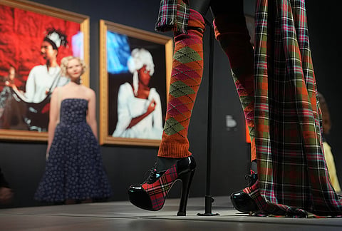 A dress "Ensemble from Anglomania collection autumn/winter 1993" by Vivienne Westwood is displayed during a media preview of "The 90s: Art and Fashion exhibition" at Tate Britain in London, Tuesday, Oct. 6, 2026. 
