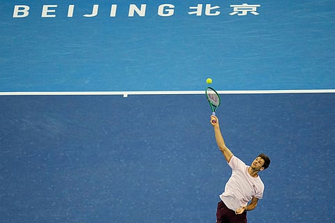 Hubert Hurkacz of Poland, serve to Alex De Minaur, of Australia, during the men's single semi-final match at the China Open tennis tournament in Beijing, Monday, Oct. 5, 2026.