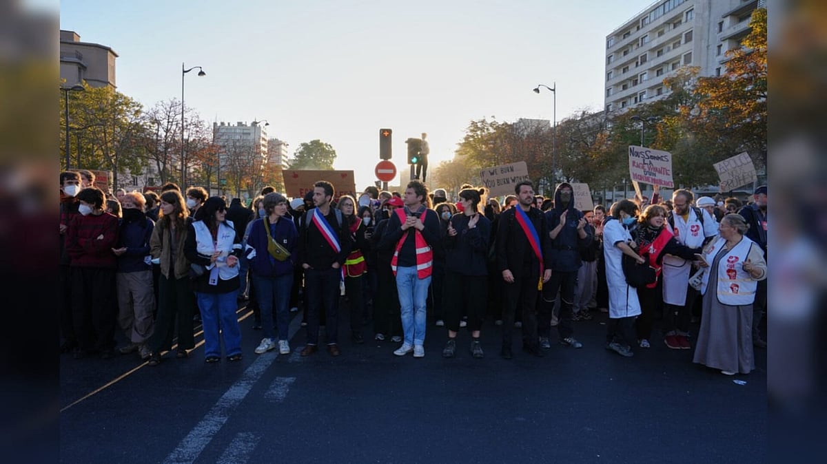 Students gather on the street before a demonstration against under-resourced schools, in Paris - AP Photo/Aurelien Morissard