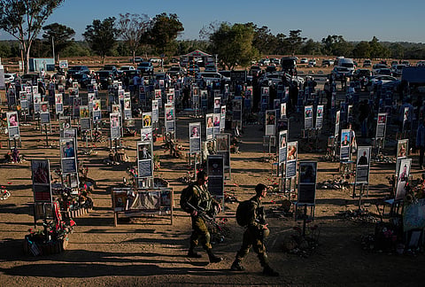 Israeli soldiers and civilians mark the third anniversary of the Oct. 7, 2023, Hamas attack on Israel at the site of the Nova music festival, where hundreds of revelers were killed and abducted, near Kibbutz Reim, southern Israel, Wednesday, Oct. 7, 2026. 
