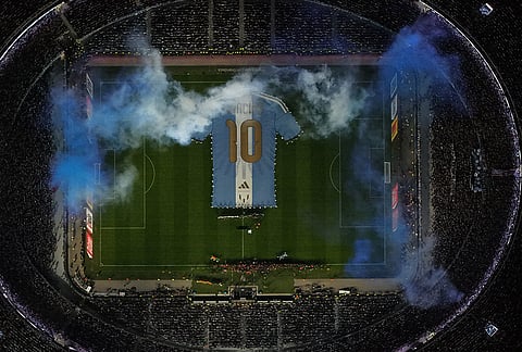 A giant t-shirt with Lionel Messi's number 10 is displayed before an international friendly soccer match against Benin, marking his farewell appearance for the national team, in Buenos Aires, Argentina, Tuesday, Oct.6, 2026. 