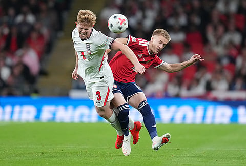England's Lewis Hall, left, and Czechia's Matej Radosta fight for the ball during the UEFA Nations League soccer match between England and Czechia in London, Tuesday, Oct. 6, 2026. 