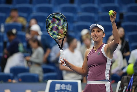Elise Mertens of Belgium celebrates after defeating Coco Gauff of the United States in the fourth round of the women's singles match at the China Open tennis tournament in Beijing.
