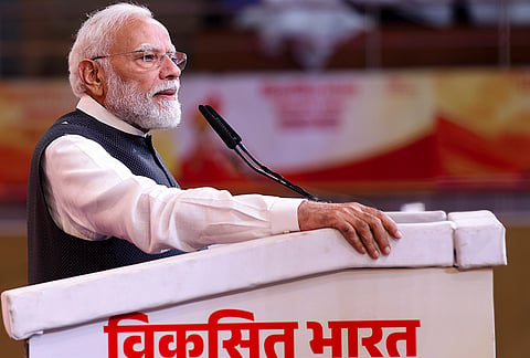 Prime Minister Narendra Modi addresses the gathering during the Viksit Bharat Sankalp Sabha at the Indira Gandhi Indoor Stadium, in New Delhi. The event marks PM Modi completing 25 years as head of government in public office, tracing back to October 7, 2001, when he was sworn in as the Chief Minister of Gujarat. 
