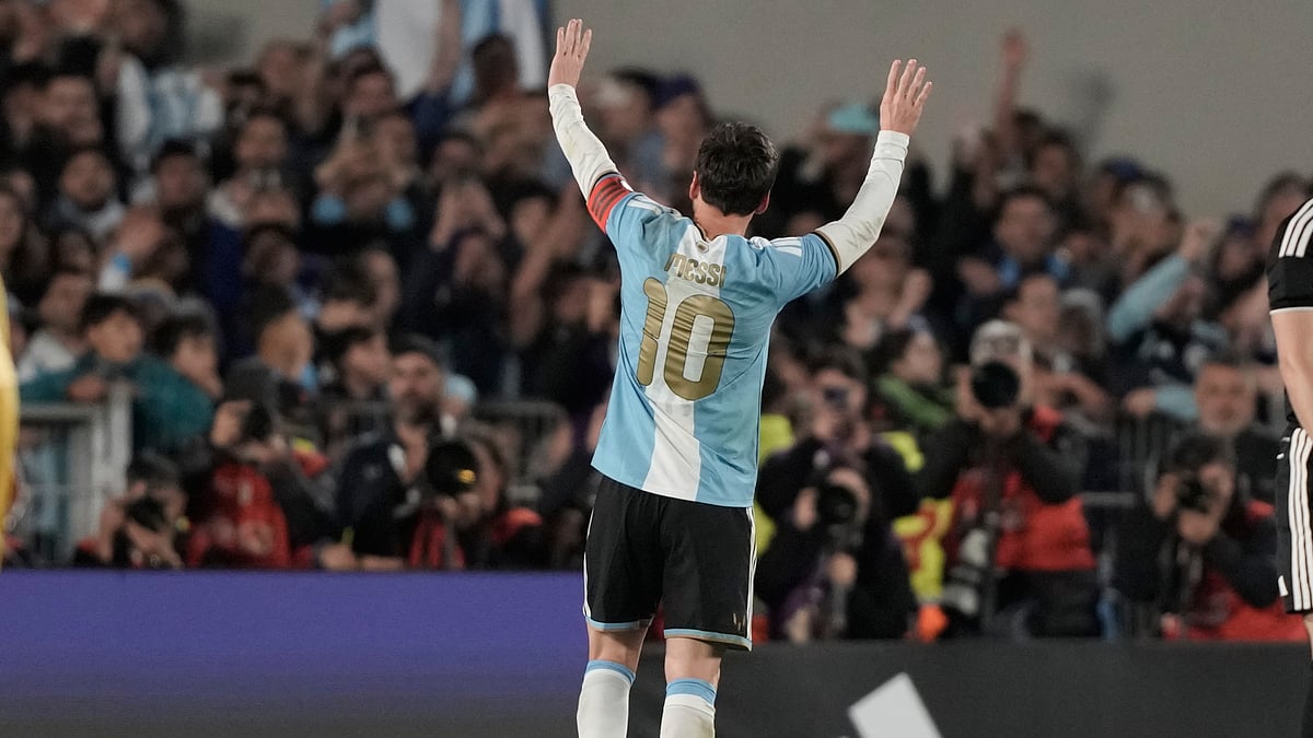 Argentina's Lionel Messi celebrates after scoring his third goal from the penalty spot during his final match for the national team, a soccer friendly against Benin, in Buenos Aires, Argentina, Tuesday, Oct.6, 2026. - (AP Photo/Natacha Pisarenko)