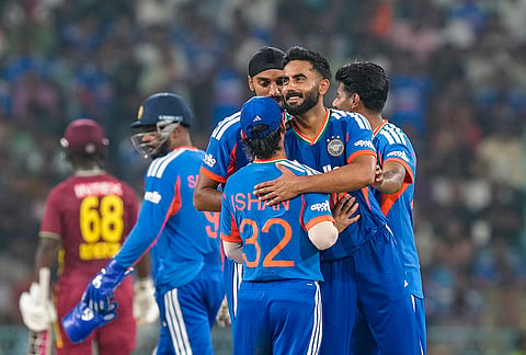 India's Naman Dhir celebrates with Ishan Kishan, Arshdeep Singh and Mayank Yadav after taking the wicket of West Indies' Shamar Springer during the first T20I cricket match of a series between India and West Indies, in Lucknow, Uttar Pradesh, Tuesday, Oct. 6, 2026. 