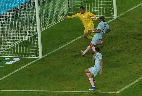 Uruguay's Juan Manuel, 25, scores a goal as India's Gurpreet Singh Sandhu looks on during an International friendly Football match between India and Uruguay, in Kolkata, Tuesday, Oct. 6, 2026. 