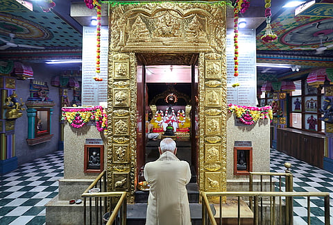 Prime Minister Narendra Modi offers prayers at the Sree Vinayaka Mandir to mark completing 25 years in public life as head of government, at Sarojini Nagar, in New Delhi. 