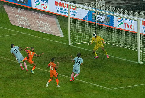 India's players, orange and Uruguay's players vie for the ball during an International friendly Football match between India and Uruguay, in Kolkata, Tuesday, Oct. 6, 2026. 

