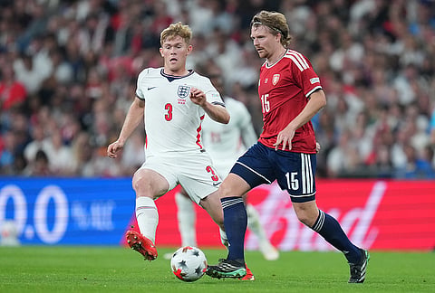 Czechia's Pavel Sulc passes the ball in front of England's Lewis Hall during the UEFA Nations League soccer match between England and Czechia in London, Tuesday, Oct. 6, 2026. 