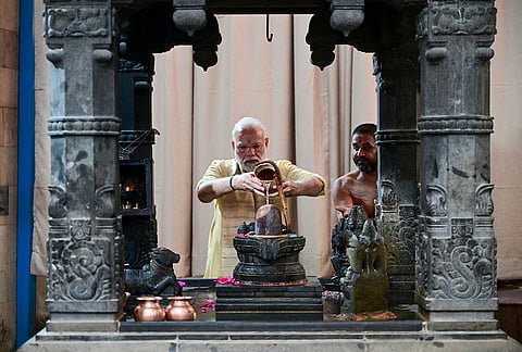 Prime Minister Narendra Modi offers prayers at the Sree Vinayaka Mandir to mark completing 25 years in public life as head of government, at Sarojini Nagar, in New Delhi. 