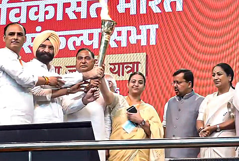 Delhi Chief Minister Rekha Gupta, BJP National President Nitin Nabin, and others, flag off the 'Seva Jyoti Yatra' to mark Prime Minister Narendra Modi's 25 years in public office, in New Delhi, Wednesday, Oct. 7, 2026. 