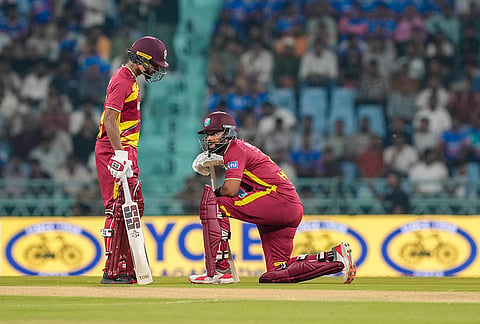 West Indies captain Shai Hope, right, and Kamil Pooran interact between the wickets during the first T20I cricket match of a series between India and West Indies, in Lucknow, Uttar Pradesh, Tuesday, Oct. 6, 2026.
