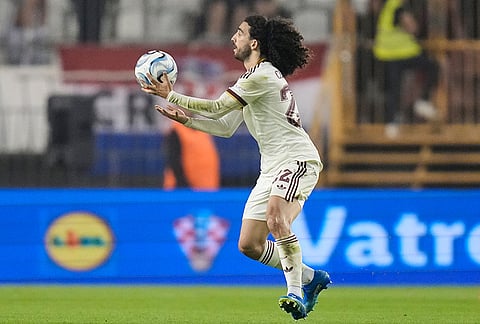 Spain's Marc Cucurella takes the ball during a Nations League soccer match between Croatia and Spain in Split, Croatia, Tuesday, Oct. 6, 2026. 
