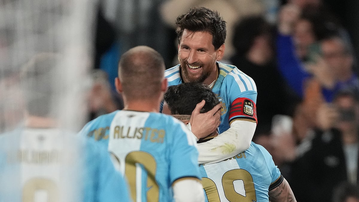 Argentina's Nicolas Otamendi, 19, celebrates with teammate Argentina's Lionel Messi after scoring his side's opening goal, during Messi's final match for the national team, a soccer friendly against Benin, in Buenos Aires, Argentina, Tuesday, Oct.6, 2026. - (AP Photo/Gustavo Garello)