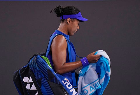 Naomi Osaka, of Japan, leaves the court after losing a match to Karolina Muchova, of the Czech Republic, in the fourth round of the women's singles match at the China Open tennis tournament in Beijing, Tuesday, Oct. 6, 2026. 