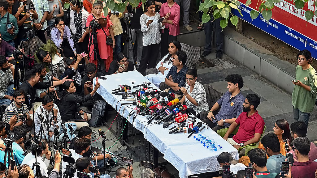 AISA National President Neha Bora addresses a joint press conference at the Press Club of India, New Delhi on Wednesday. CJP Chief spokesperson Sourabh Das, SFI and ASAP representatives also present - ANI