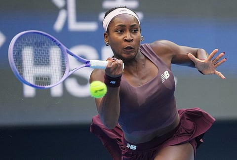 Coco Gauff of the United States returns a ball to Elise Mertens of Belgium during the fourth round of the women's singles match at the China Open tennis tournament in Beijing, Wednesday, Oct. 7, 2026. 