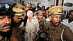 Sri Lanka’s Rajapaksa Family Faces Another Graft Case AP Photo/Lahiru Harshana : Prison officers escort Shiranthi Rajapaksa, the wife of Sri Lanka's former President Mahinda Rajapaksa, to a prison vehicle outside a magistrate's court in Colombo