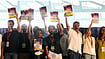 | Photo: AP/Aijaz Rahi : Indian influencer and activist Dhruv Rathee, left, Cockroach Janta Party founder Abhijeet Dipke, fifth left, Indian actor Prakash Raj, seventh left, and other supporters carry copies of a report on Special Intensive Revision (SIR), which removed a large number of Indian voters from the electoral roll, during a protest demanding the resignation of the country's election chief Gyanesh Kumar, in Bengaluru, India, Thursday, Oct. 8, 2026. 
