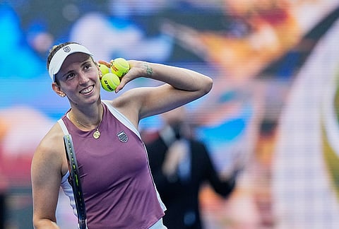 Elise Mertens of Belgium reacts after defeating Coco Gauff of the United States during the fourth round of the women's singles match at the China Open tennis tournament in Beijing, Wednesday, Oct. 7, 2026. 