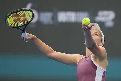 Elise Mertens of Belgium serves to Coco Gauff of the United States during the fourth round of the women's singles match at the China Open tennis tournament in Beijing, Wednesday, Oct. 7, 2026. 