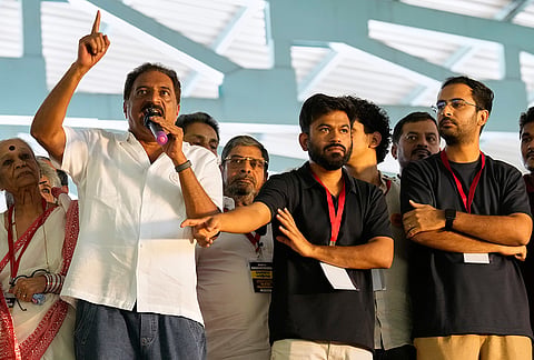 Indian actor Prakash Raj, left, speaks as Cockroach Janta Party founderAbhijeet Dipke, center, gestures during a protest gathering demanding the resignation of the country's election chief Gyanesh Kumar, in Bengaluru, India, Thursday, Oct. 8, 2026. 