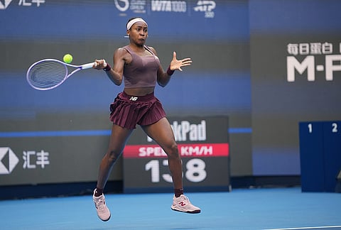 Coco Gauff of the United States returns a ball to Elise Mertens of Belgium during the fourth round of the women's singles match at the China Open tennis tournament in Beijing, Wednesday, Oct. 7, 2026. 
