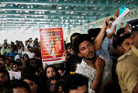 Supporters of India's Cockroach Janta Party display placards during a protest gathering demanding the resignation of the country's election chief Gyanesh Kumar, in Bengaluru, India, Thursday, Oct. 8, 2026. 