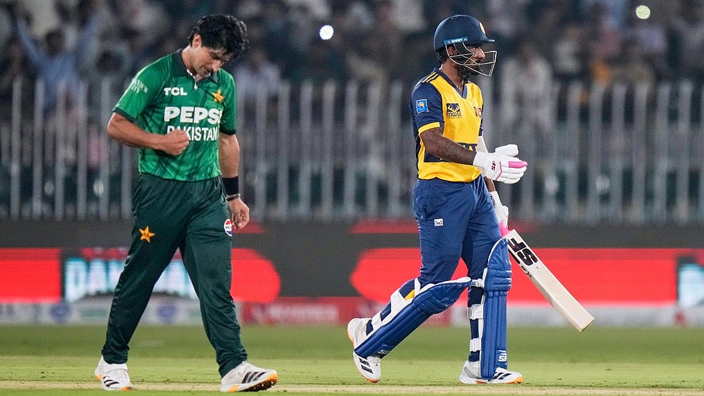 Pakistan's Naseem Shah, left, celebrates after taking the wicket of Sri Lanka's Lahiru Udara, right, during the first T20 cricket match between Pakistan and Sri Lanka, in Rawalpindi, Pakistan. - Anjum Naveed/AP Photo