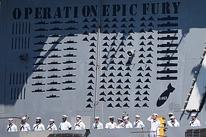| Photo: AP/Gregory Bull : Sailors stand aboard the USS Abraham Lincoln aircraft carrier as it returns to Naval Air Station North Island after deployment Thursday, Oct. 8, 2026, in Coronado, Calif.