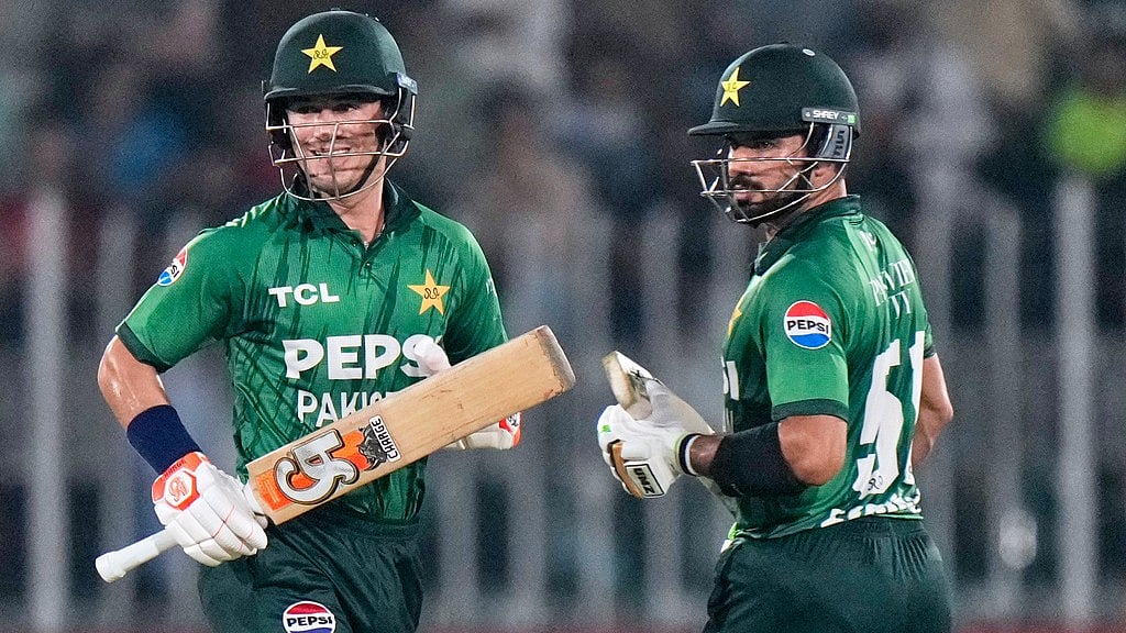 Pakistan's Maaz Sadaqat, left and Sahibzada Farhan run between the wickets during the first T20 cricket match between Pakistan and Sri Lanka, in Rawalpindi, Pakistan. - Anjum Naveed/AP Photo
