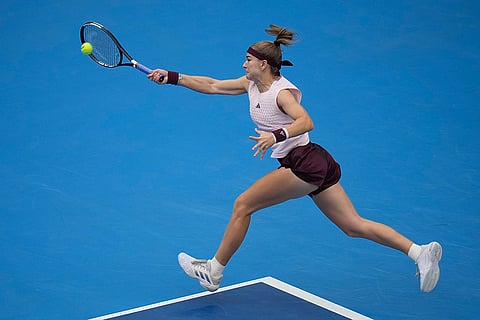 Karolina Muchova of the Czech Republic returns the ball to compatriot Nikola Bartunkova during the quarterfinals of the women's singles match at the China Open tennis tournament in Beijing, Thursday, Oct. 8, 2026.