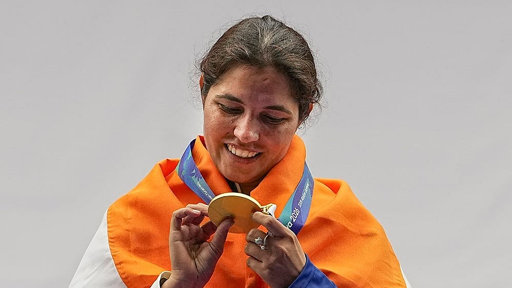 India's Neeru Dhanda looks at her gold medal during the victory ceremony for the women's trap shooting individual event at the 20th Asian Games 2026, in Nagoya, Japan, Tuesday, Sept. 29, 2026.  - | Photo: PTI/Atul Yadav