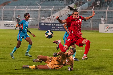 Players of India and Russia vie for the ball during a FIFA international friendly women's football match between India and Russia, at the Kishore Bharati Krirangan, in Kolkata, West Bengal, Thursday, Oct. 8, 2026.