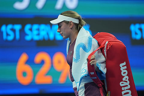 Ekaterina Alexandrova, of Russia, leave the court after losing against Mirra Andreeva, of Russia in the quarterfinals of the women's singles match at the China Open tennis tournament in Beijing, Thursday, Oct. 8, 2026.