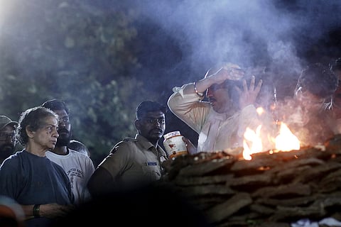 Veteran actor Nana Patekar's son Malhar Patekar performs rituals during the former's cremation at his farmhouse at Donje village, in Pune district, late Thursday, Oct. 8, 2026. The last rites of the 75-year-old actor, who essayed many memorable roles on the silver screen, were performed with full state honours amid the chants of "Nana Amar Rahe" (Long Live Nana).