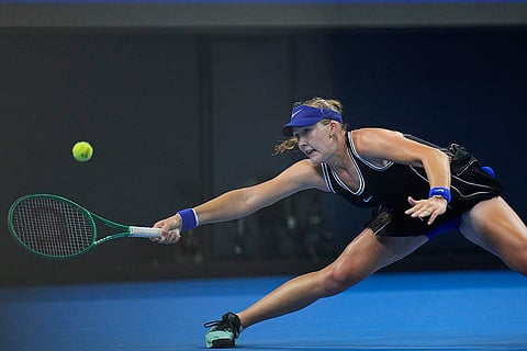 Mirra Andreeva, of Russia, returns a ball to Ekaterina Alexandrova, of Russia during the quarterfinals of the women's singles match at the China Open tennis tournament in Beijing, Thursday, Oct. 8, 2026.