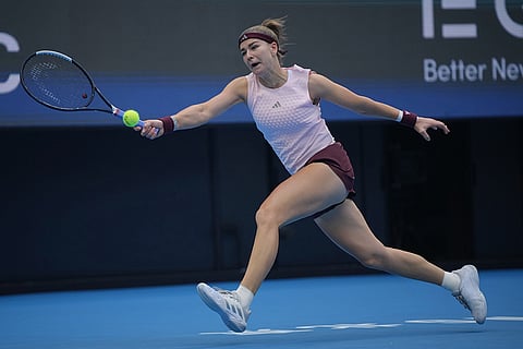 Karolina Muchova of the Czech Republic plays a forehand return to Nikola Bartunkova of the Czech Republic during the quarterfinals of the women's singles match at the China Open tennis tournament in Beijing, Thursday, Oct. 8, 2026.