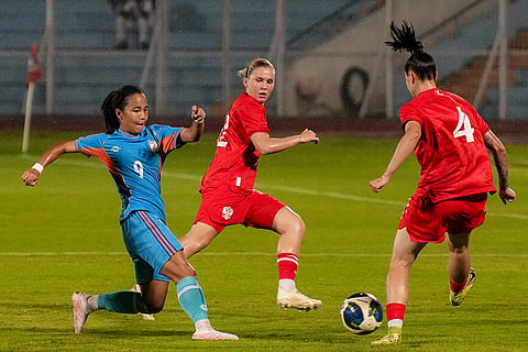 India's Lynda Kom Serto, 9, passes the ball during a FIFA international friendly women's football match between India and Russia, at the Kishore Bharati Krirangan, in Kolkata, West Bengal, Thursday, Oct. 8, 2026.