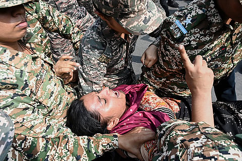 Security personnel detain a protester during a youth demonstration demanding the resignation of the country's election chief Gyanesh Kumar, in New Delhi, India, Saturday, Oct. 10, 2026.