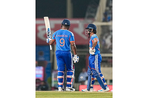 India's Sanju Samson, left, celebrates his half century as Ishan Kishan looks on during the second T20I cricket match of a series between India and West Indies, in Ranchi, Jharkhand, Friday, Oct. 9, 2026.