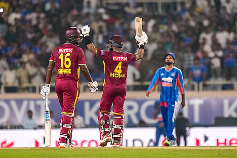 West Indies' captain Shai Hope, right, celebrates with Romario Shepherd after winning the second T20I cricket match of a series between India and West Indies, in Ranchi, Jharkhand, Friday, Oct. 9, 2026. 