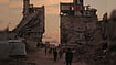 Over 100 NGOs Say Gaza Ceasefire ‘Exists In Name Only’ AP Photo/Jehad Alshrafi : Palestinians walk along a street surrounded by buildings destroyed in Israeli military strikes during the Israel-Hamas war in Gaza City