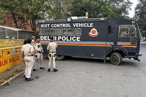 A riot control police vehicle stays ready near the venue of a youth protest demanding the resignation of the country's election chief Gyanesh Kumar, in New Delhi, India, Saturday, Oct. 10, 2026.