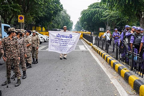 Security personnel keep vigil as heavy police deployment and entry restrictions are enforced ahead of a planned protest by Cockroach Janta Party (CJP) members, in New Delhi, Saturday, Oct. 10, 2026.