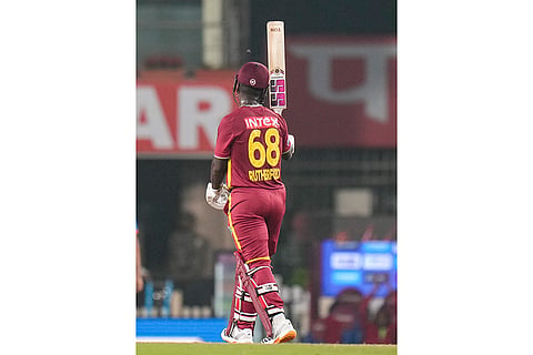 West Indies' Sherfane Rutherford celebrates his half century during the second T20I cricket match of a series between India and West Indies, in Ranchi, Jharkhand, Friday, Oct. 9, 2026. 