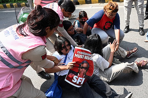 Police personnel detain protesters during a youth demonstration demanding the resignation of the country's election chief Gyanesh Kumar, in New Delhi, India, Saturday, Oct. 10, 2026.